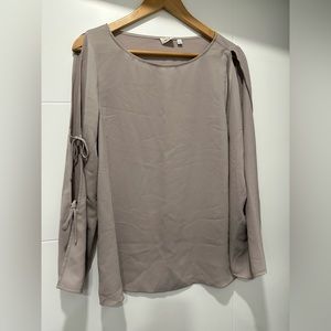 Blouse with open arms and ties. Never worn.